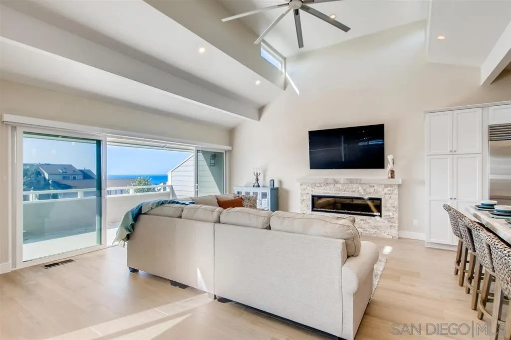 1765 Tattenham Road Encinitas, CA 92024 - Photo 8 of 25 a living room with fireplace furniture and a flat screen tv