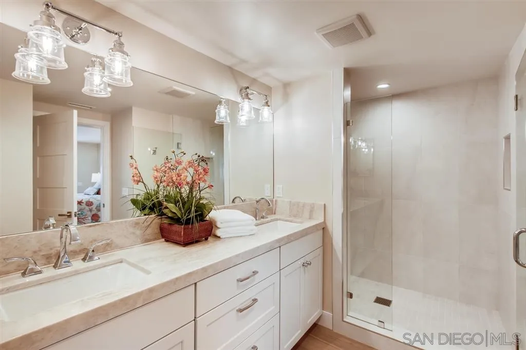 1765 Tattenham Road Encinitas, CA 92024 - Photo 10 of 25 a bathroom with a sink a potted plant and a mirror