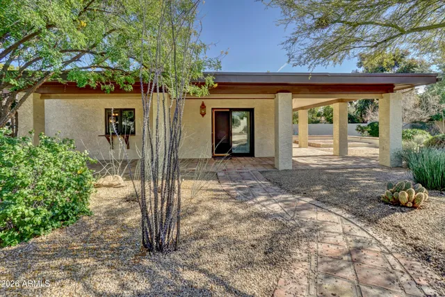 a front view of a house with a porch