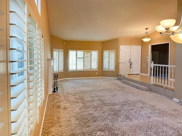 a view of an empty room and window