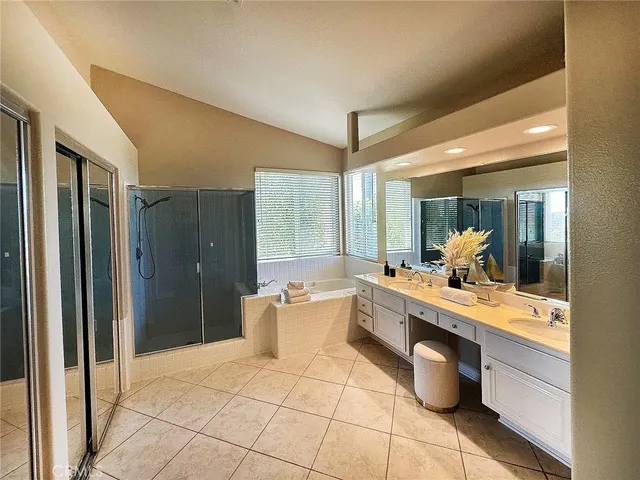 a bathroom with a bath tub and shower