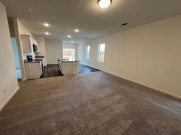 a view of kitchen with wooden floor
