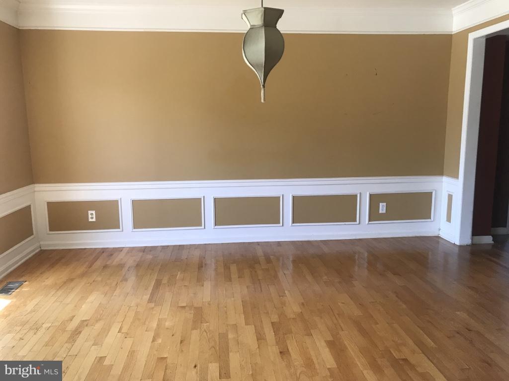 9 Leamington Road Fredericksburg, VA 22406 - Photo 3 of 12 a view of an empty room with wooden floor