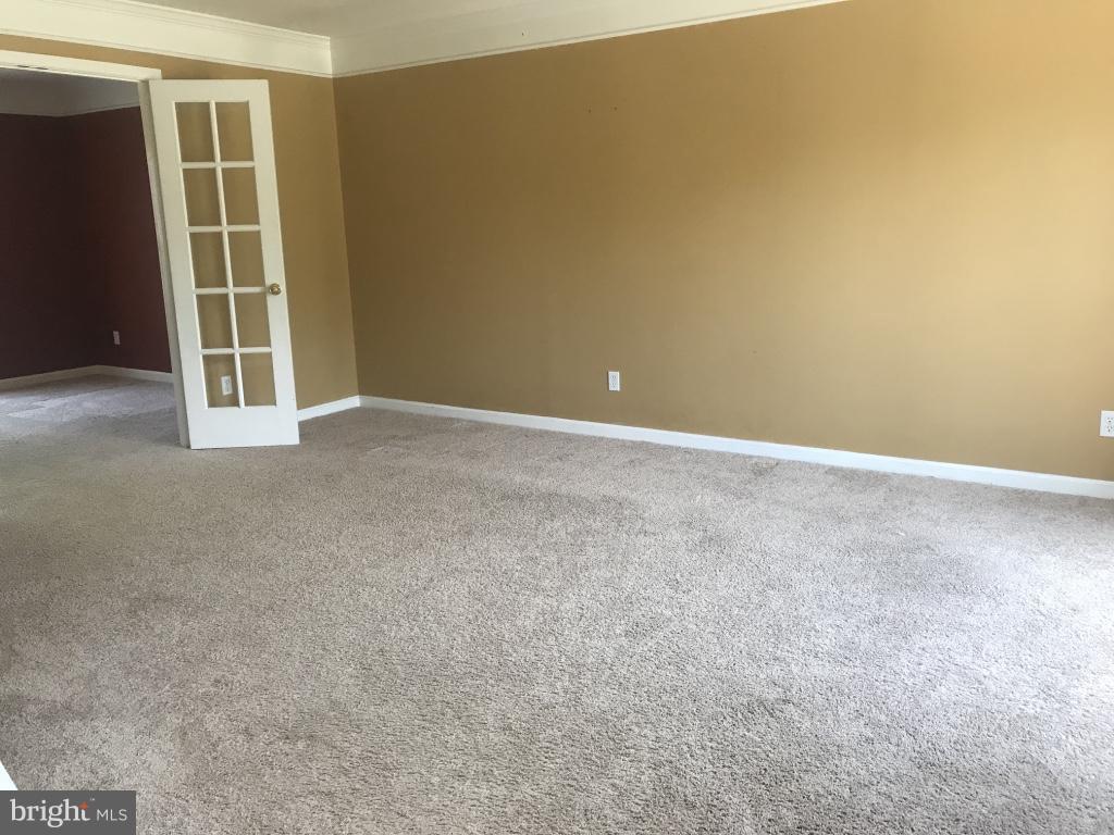 9 Leamington Road Fredericksburg, VA 22406 - Photo 4 of 12 an empty room with windows