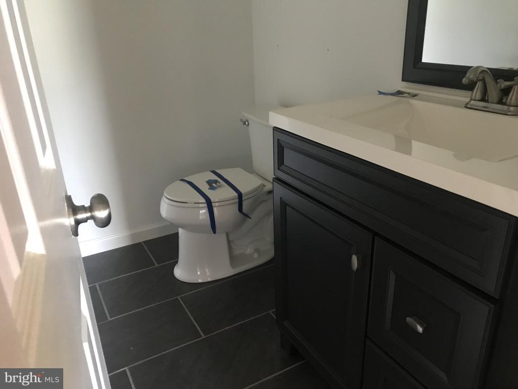 9 Leamington Road Fredericksburg, VA 22406 - Photo 7 of 12 a bathroom with a sink and toilet