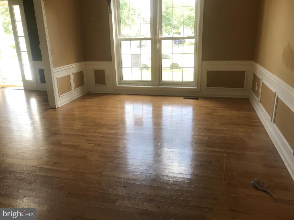 9 Leamington Road Fredericksburg, VA 22406 - Photo 8 of 12 a view of empty room with wooden floor and fan