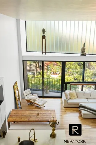 a room with furniture and large windows