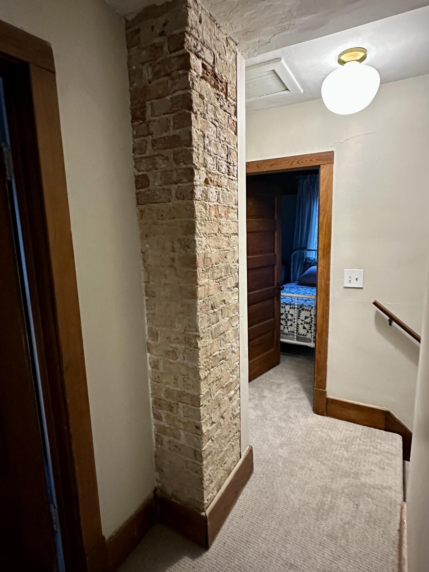 613 Wayne Street St. Joseph, MI 49085 - Photo 21 of 36 exposed brick hall