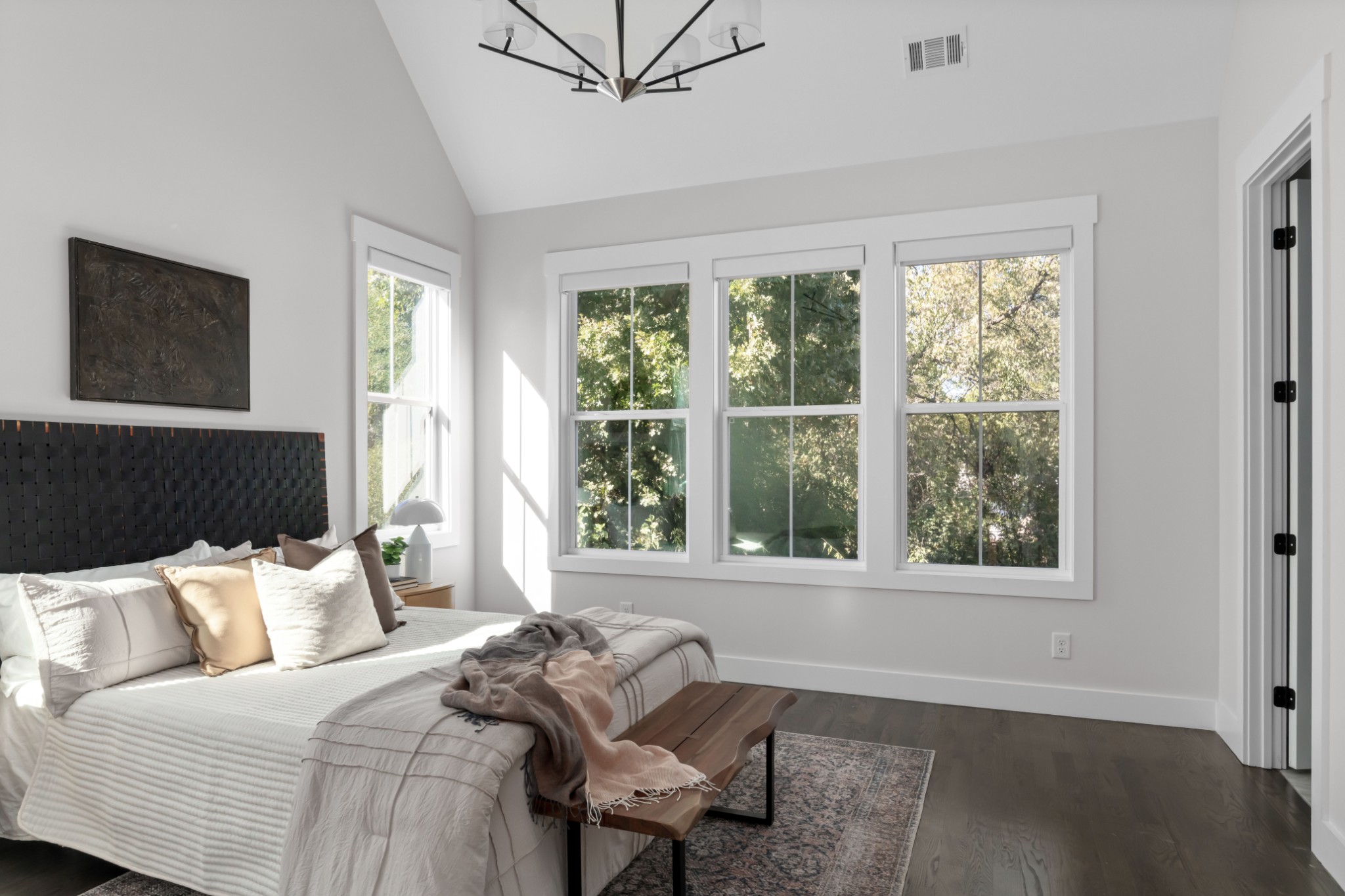 2 B Belle Forrest Avenue Nashville, TN 37206 - Photo 23 of 53 a bed sitting in a bedroom next to a window