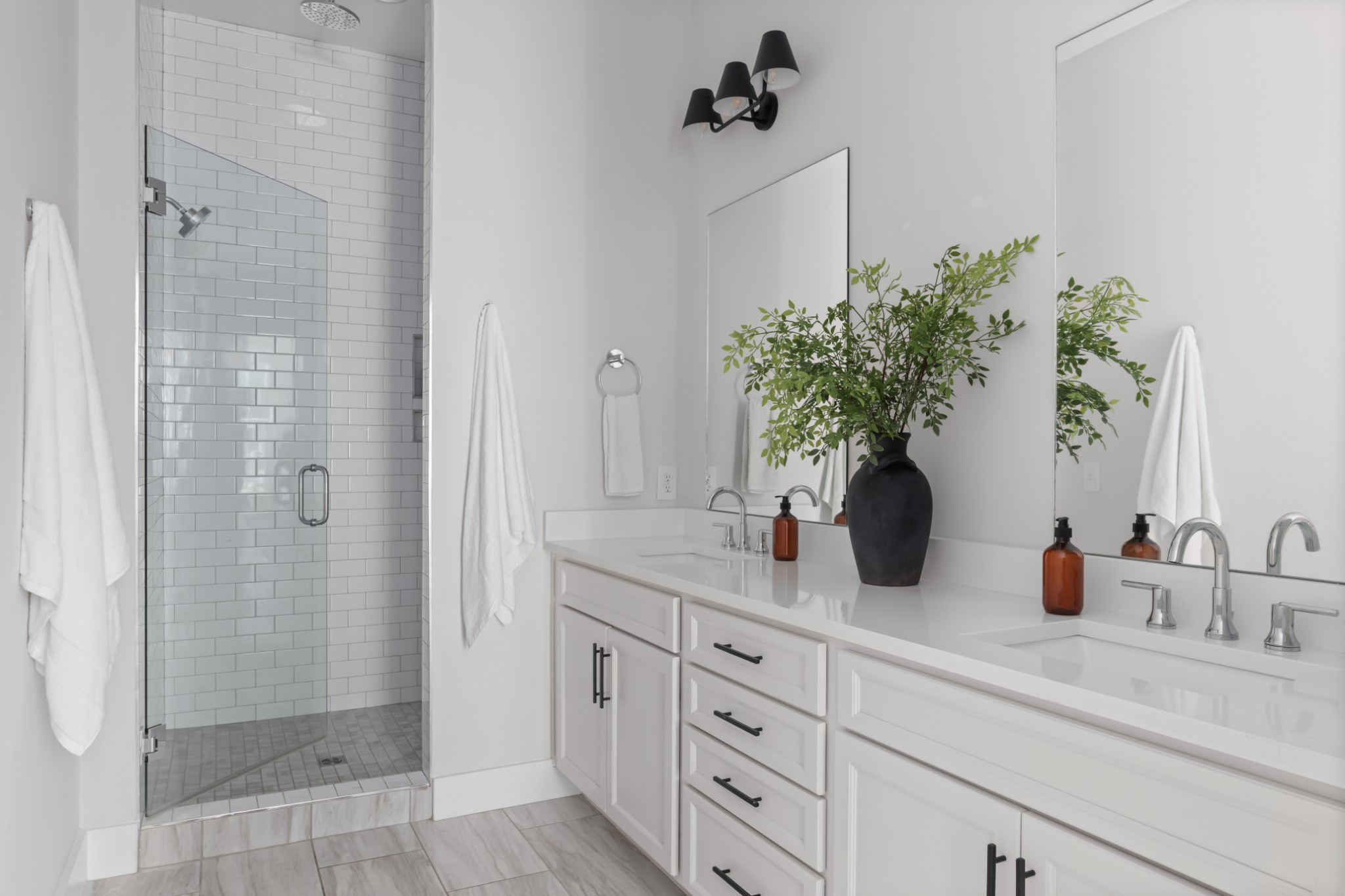 2 B Belle Forrest Avenue Nashville, TN 37206 - Photo 26 of 53 a bathroom with a shower sink and mirror