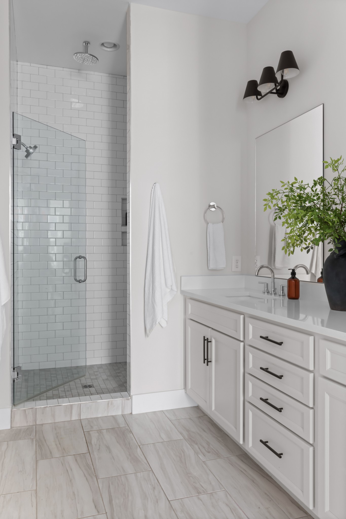 2 B Belle Forrest Avenue Nashville, TN 37206 - Photo 28 of 53 a bathroom with a granite countertop sink a mirror and shower