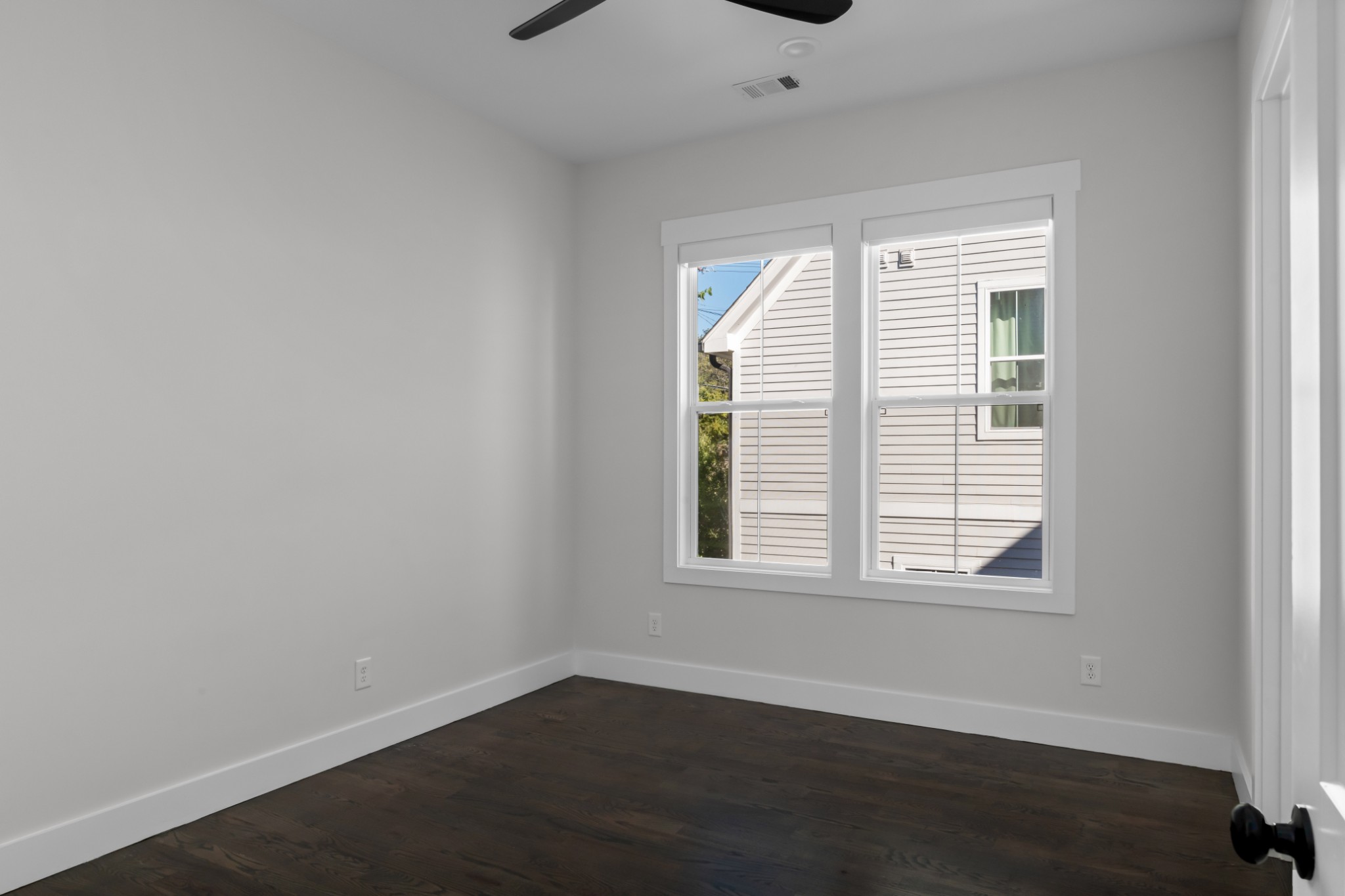 2 B Belle Forrest Avenue Nashville, TN 37206 - Photo 37 of 53 an empty room with wooden floor and windows