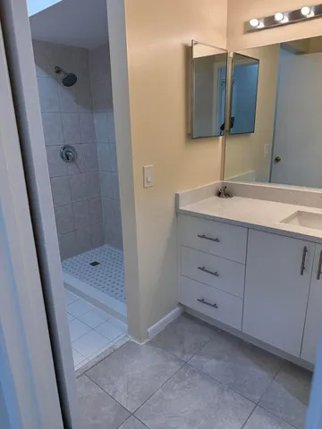 a view of a patio with table and chairs