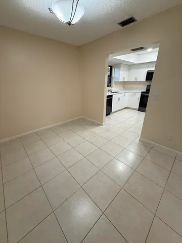 a kitchen with a sink a stove and cabinets