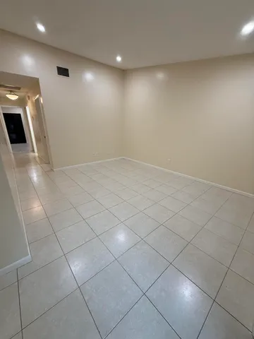 a view of an empty room with a sink
