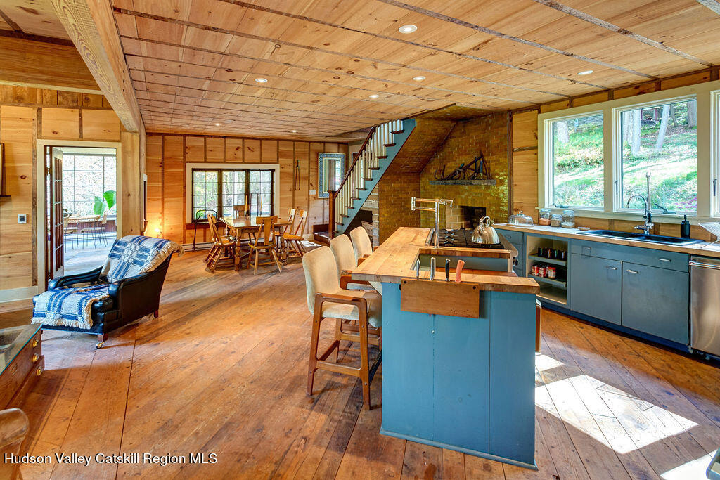166-168 Dry Brook Road Arkville, NY 12406 - Photo 11 of 49 a view of a dining room with furniture a chandelier and wooden floor