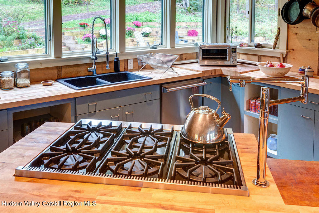 166-168 Dry Brook Road Arkville, NY 12406 - Photo 14 of 49 a kitchen with a sink and a stove next to a window