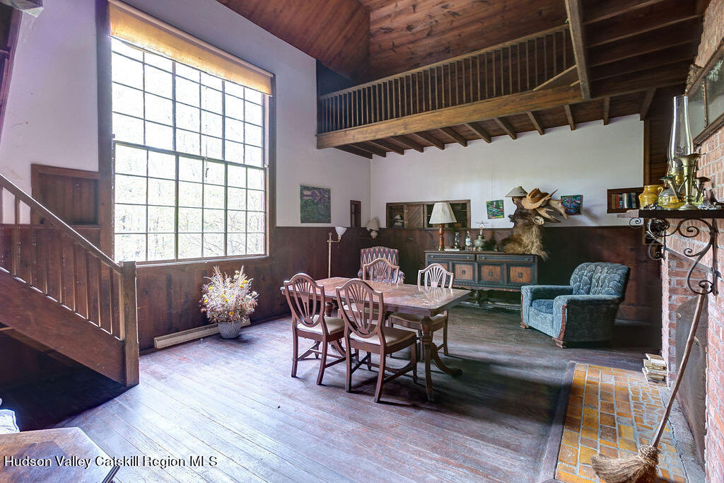 166-168 Dry Brook Road Arkville, NY 12406 - Photo 38 of 49 a dining room with furniture window and wooden floor
