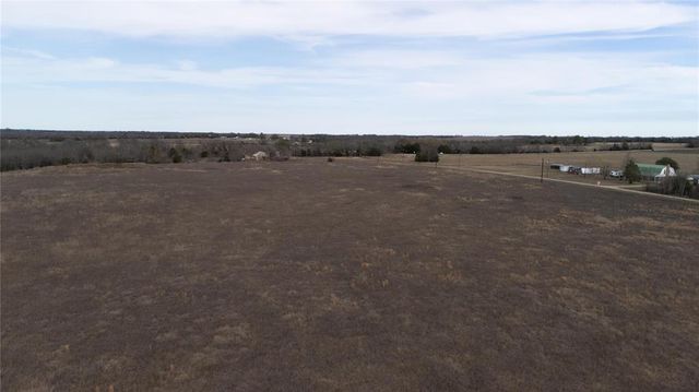 a view of an ocean and mountain