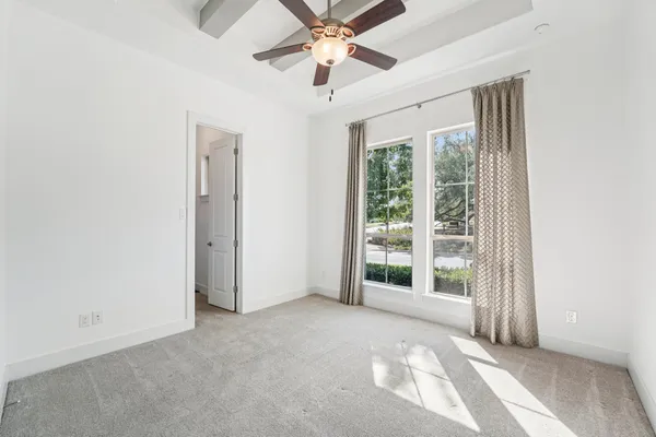 a kitchen with stainless steel appliances granite countertop a stove a sink dishwasher and a refrigerator with wooden floor