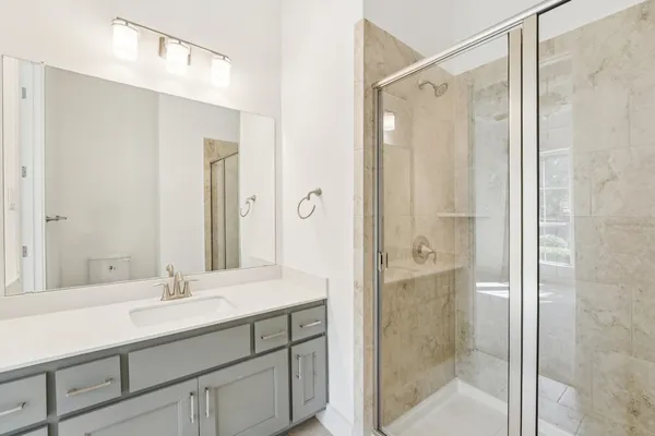 a kitchen with granite countertop cabinets and window