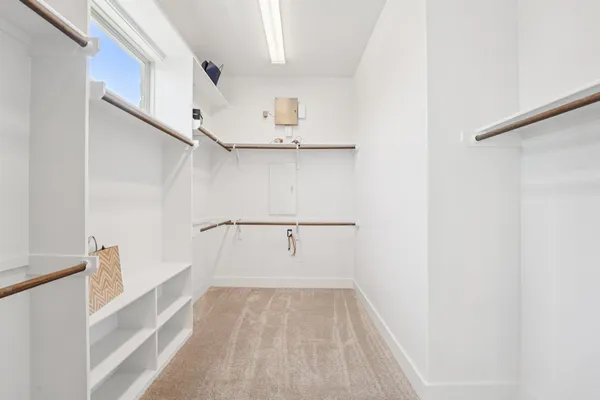 a spacious bathroom with a double vanity sink a mirror and a bathtub