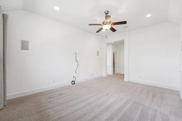 a view of a hallway with chandelier