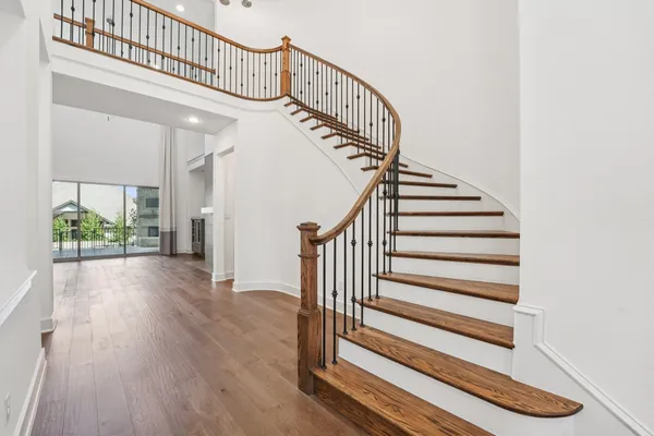 a view of entryway with wooden floor