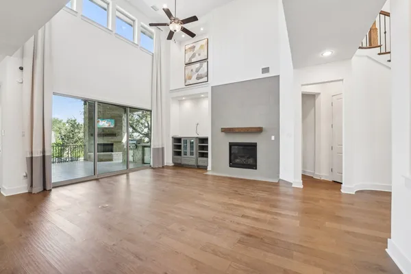 a view of kitchen with kitchen island and stainless steel appliances