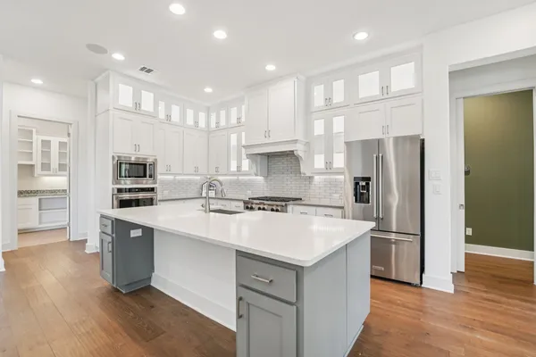 a view of kitchen and kitchen with a sink