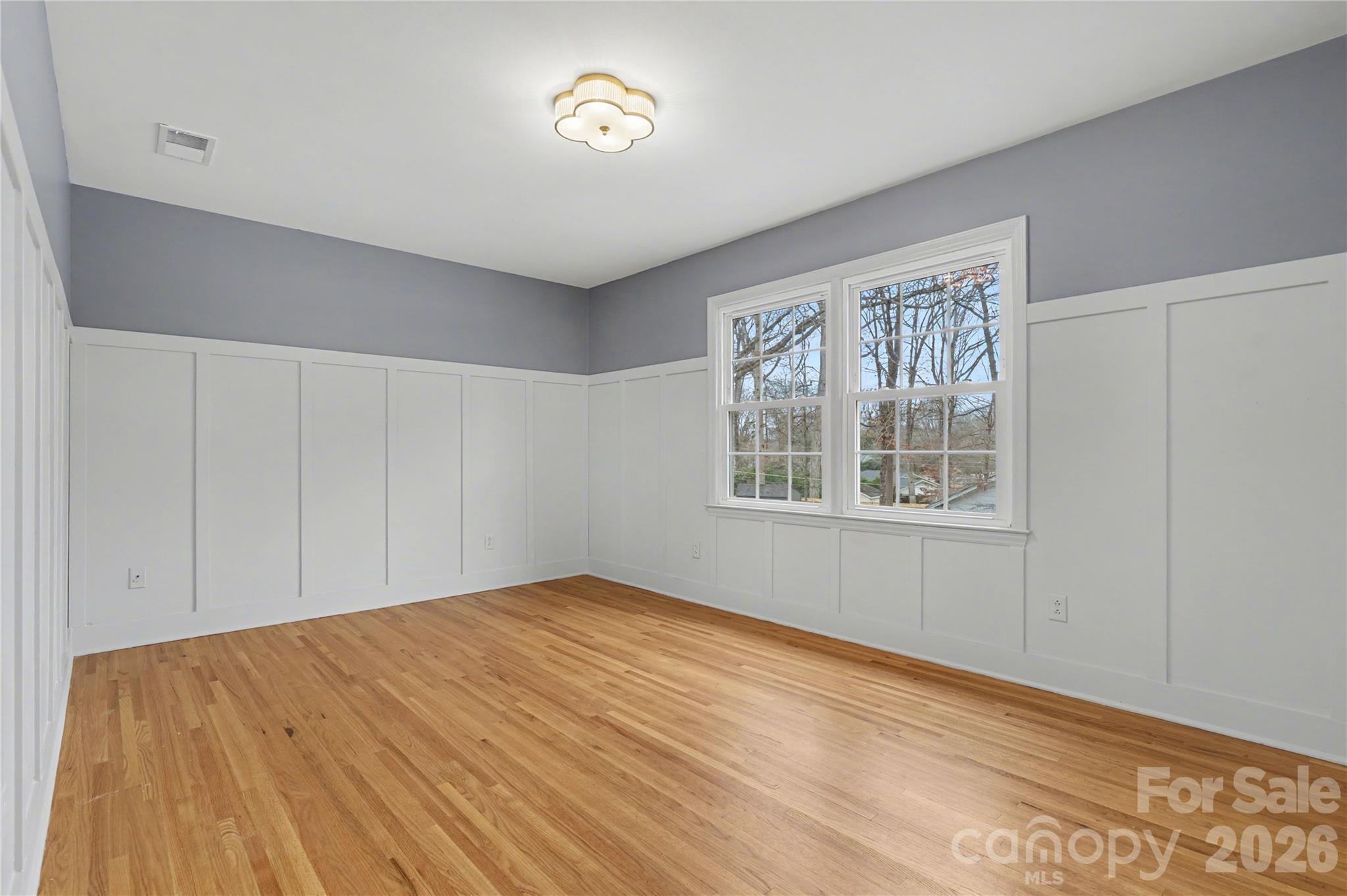 819 Ashmeade Road Charlotte, NC 28211 - Photo 30 of 42 wooden floor in an empty room with a window