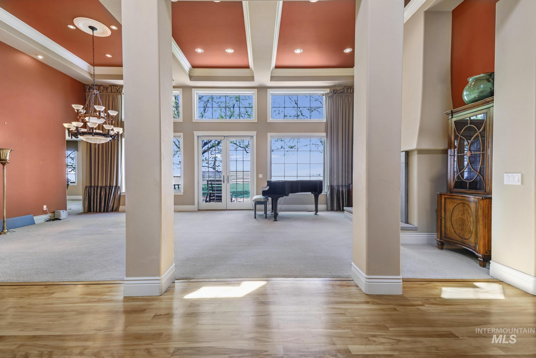 1526 Highway 26 Gooding, ID 83330 - Photo 3 of 48 Entrance foyer with a chandelier, a high ceiling, wood finished floors, carpet flooring, and recessed lighting