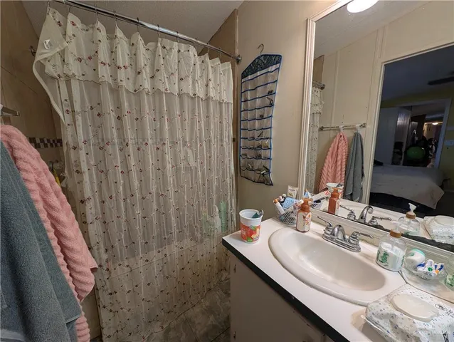 a living room with furniture and a chair