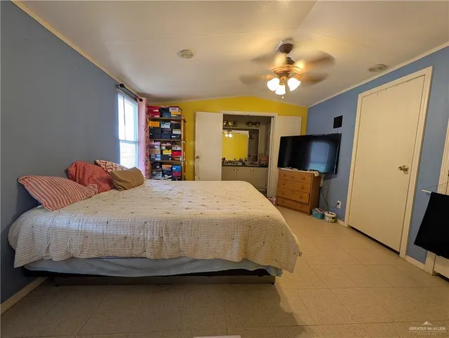 a room with furniture a rug and a chandelier