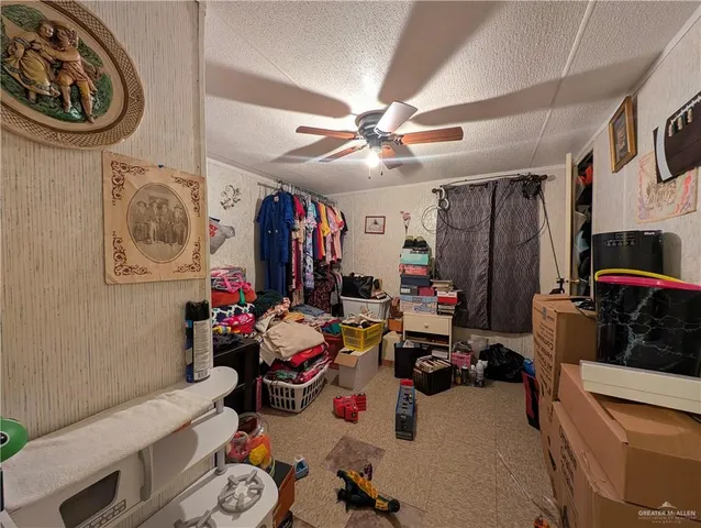 a bathroom with a sink toilet and shower curtain
