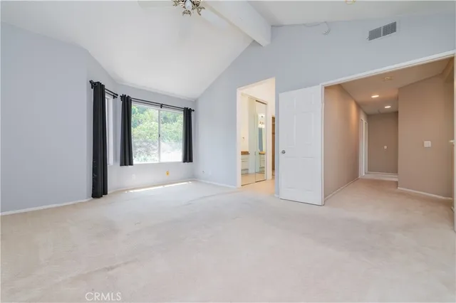 a bathroom with a granite countertop sink a large mirror and a shower