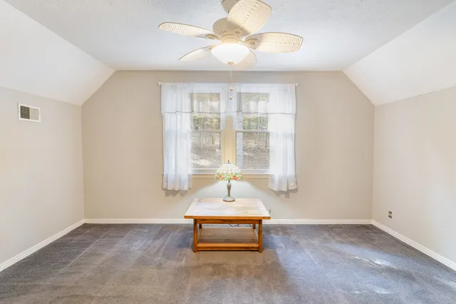 a bedroom with bed and window