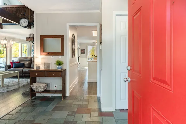 a living room with furniture and a table