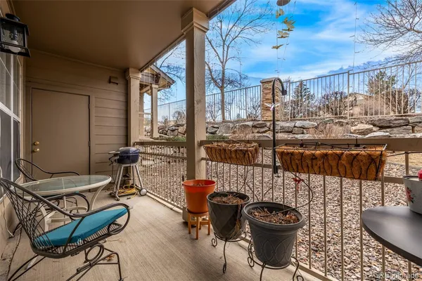 a living room with fireplace furniture and a large window