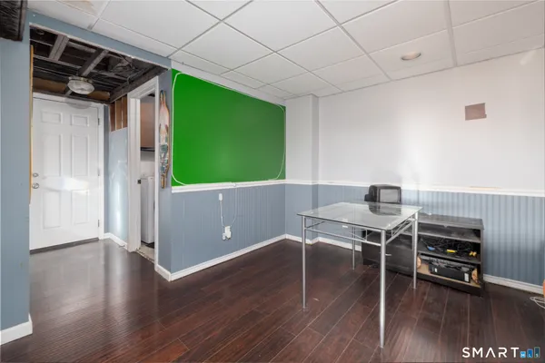 a workspace with furniture window and wooden floor