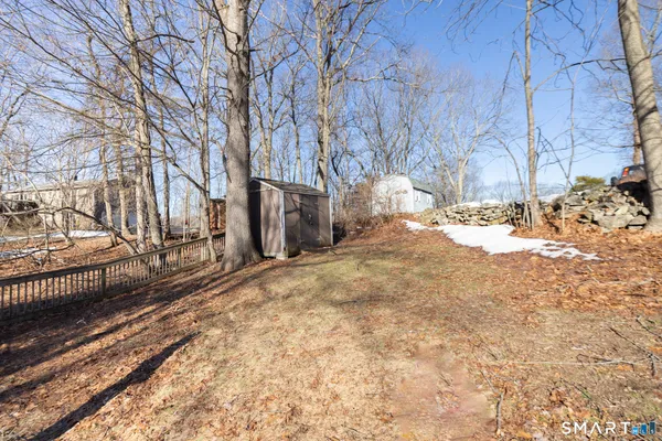 a view of a yard covered with snow in the back