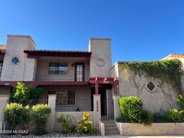 front view of a house with a garden