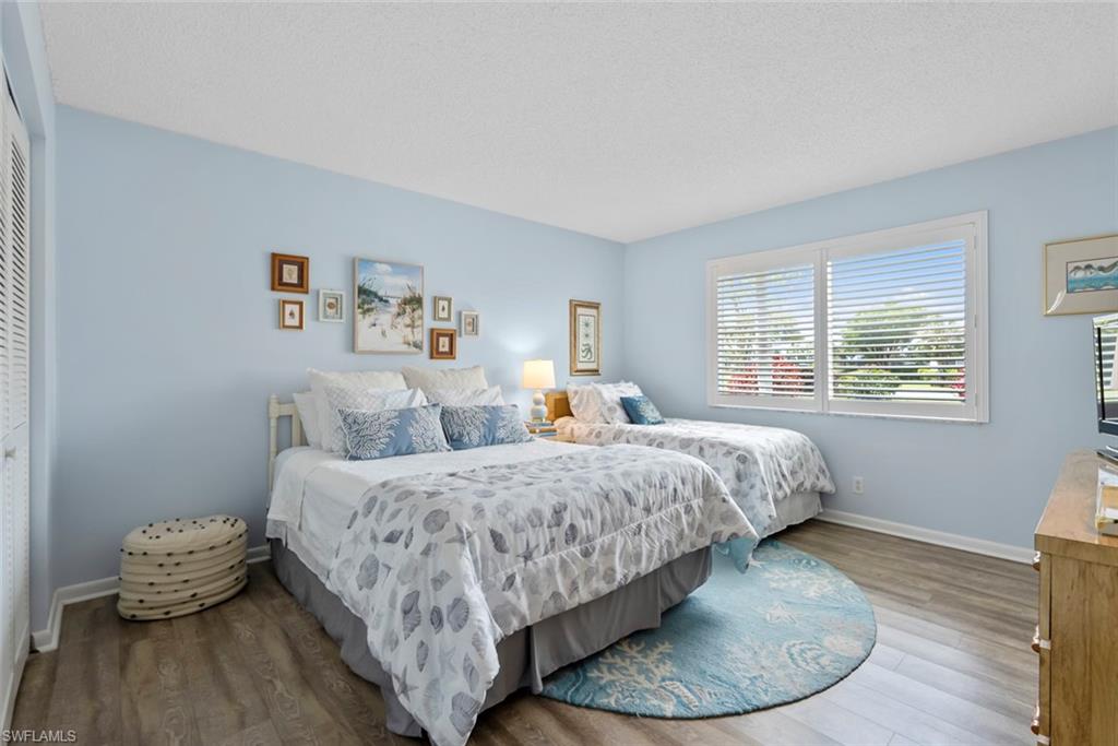 500 Teryl Road, Unit 1 Naples, FL 34112 - Photo 11 of 20 a bed room with a bed and a window