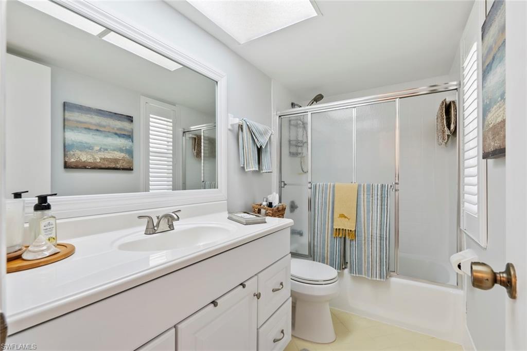 500 Teryl Road, Unit 1 Naples, FL 34112 - Photo 12 of 20 a bathroom with a sink toilet and shower