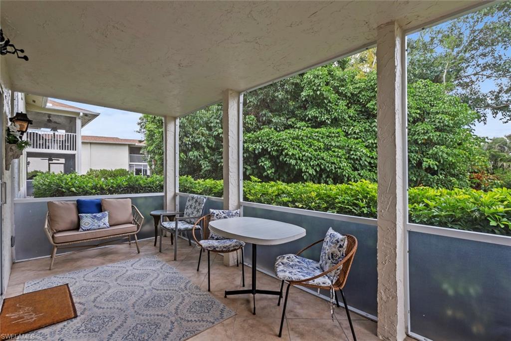500 Teryl Road, Unit 1 Naples, FL 34112 - Photo 17 of 20 a view of a patio with a table chairs and backyard