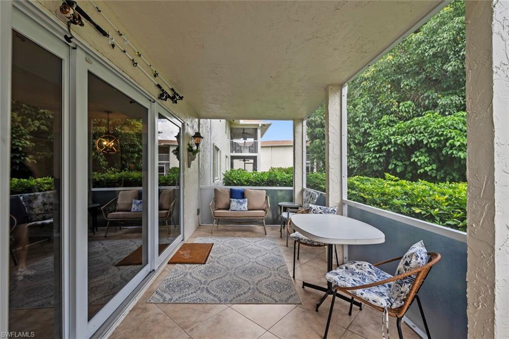 500 Teryl Road, Unit 1 Naples, FL 34112 - Photo 18 of 20 a balcony with furniture and a potted plant