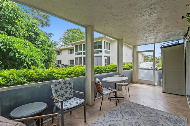 a outdoor dining space with furniture and a potted plant