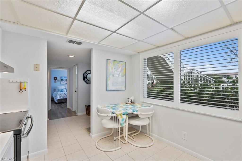 500 Teryl Road, Unit 1 Naples, FL 34112 - Photo 8 of 20 a dining room with furniture and a window