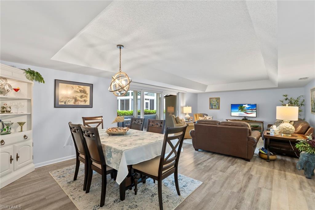 500 Teryl Road, Unit 1 Naples, FL 34112 - Photo 10 of 20 a view of a dining room with furniture and window