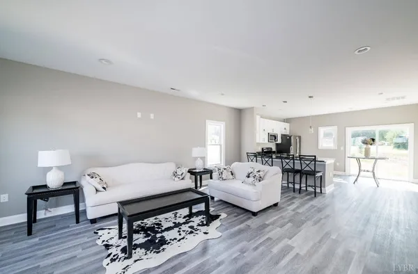 a bedroom with furniture and a wooden floor